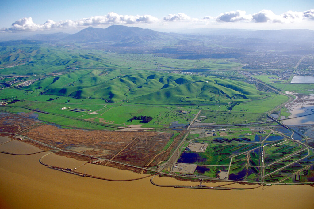 Aerial view of green hills rising toward Mount Diablo, seen from Concord in Contra Costa County